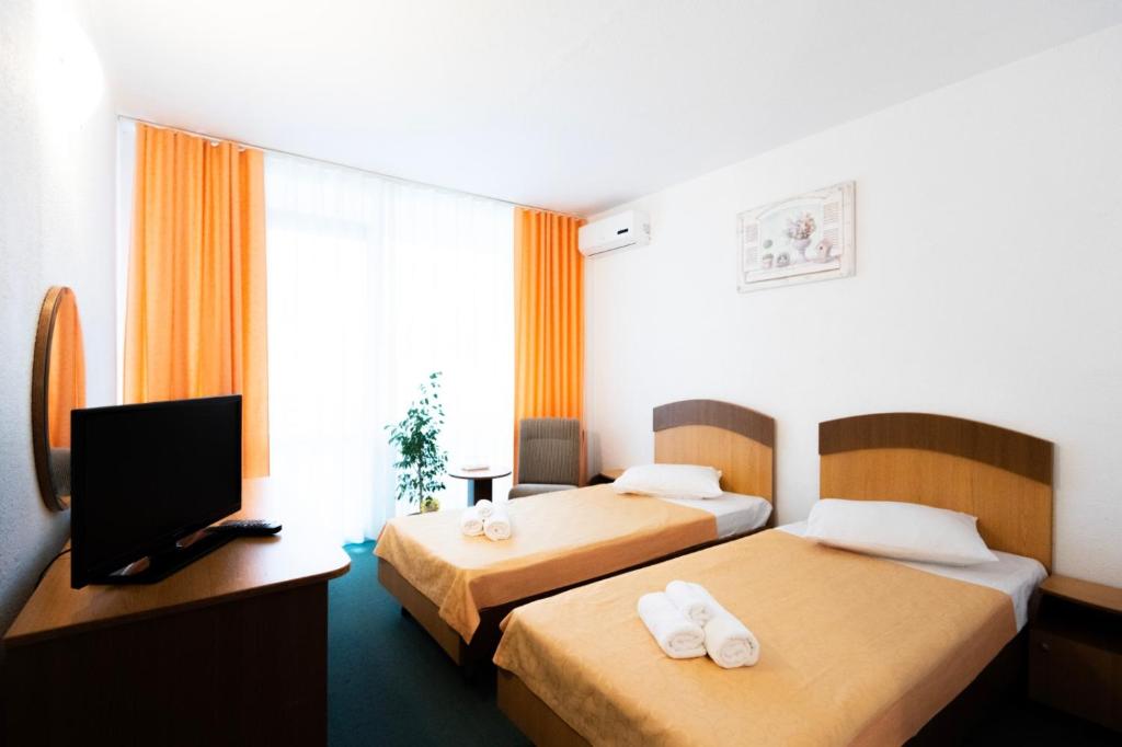 Postel nebo postele na pokoji v ubytování Hotel Siret Saturn