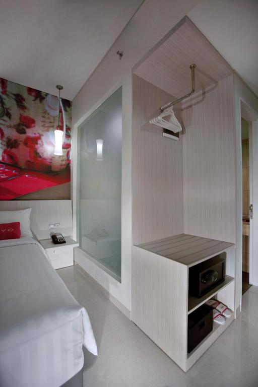 Postel nebo postele na pokoji v ubytování favehotel Langko Mataram - Lombok