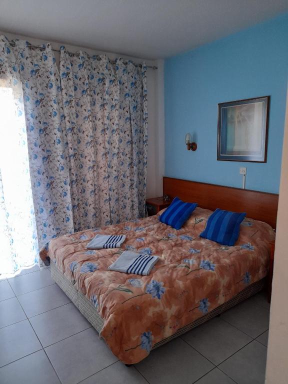 Postel nebo postele na pokoji v ubytování Onisillos Hotel