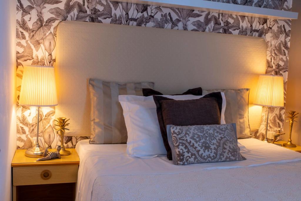 Postel nebo postele na pokoji v ubytování Hotel Maarea