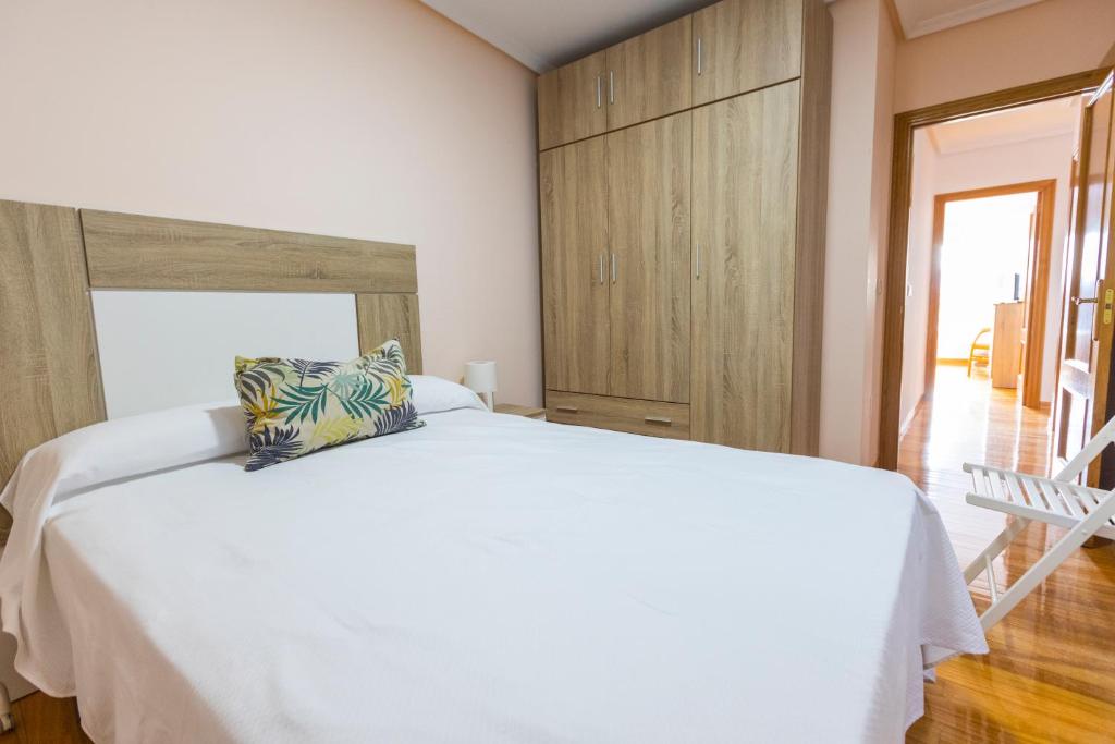 Postel nebo postele na pokoji v ubytování Apartagal-Edificio Celtas Foz