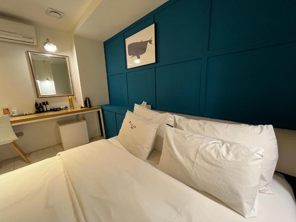 Postel nebo postele na pokoji v ubytování Hotel Yaja Hwajeong Station