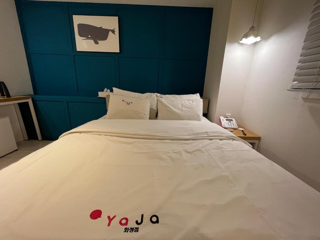 Postel nebo postele na pokoji v ubytování Hotel Yaja Hwajeong Station