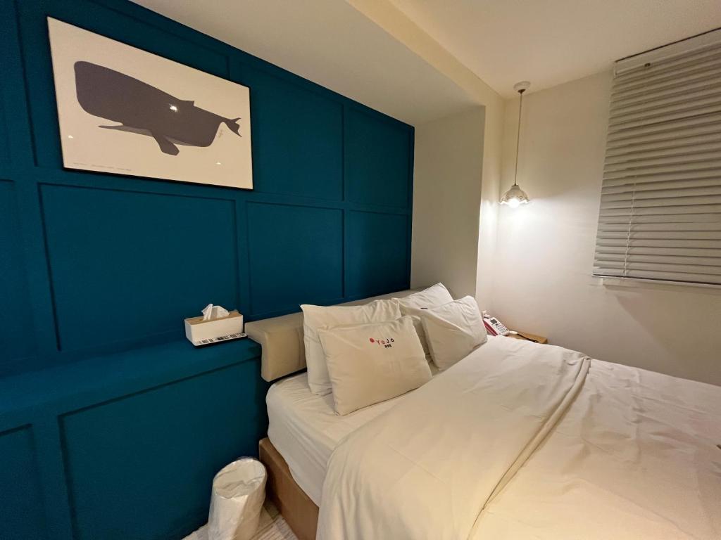 Postel nebo postele na pokoji v ubytování Hotel Yaja Hwajeong Station