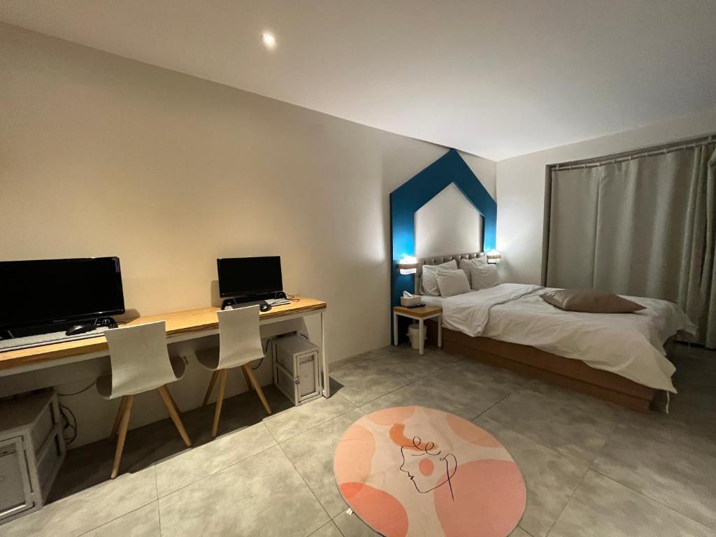 Postel nebo postele na pokoji v ubytování Hotel Yaja Hwajeong Station