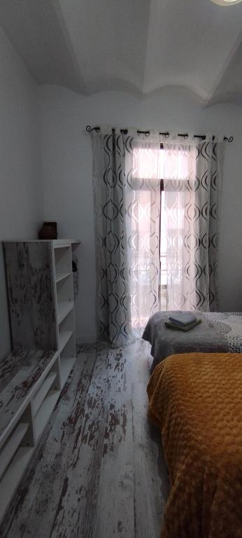 Postel nebo postele na pokoji v ubytování Apartment Fira Bcn Camp Nou