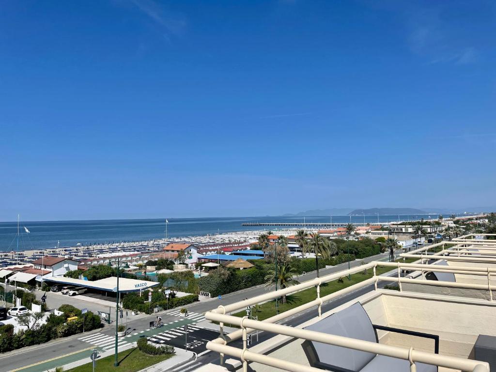 a view of a city and the ocean from a building at Hotel Atlantico in Forte dei Marmi