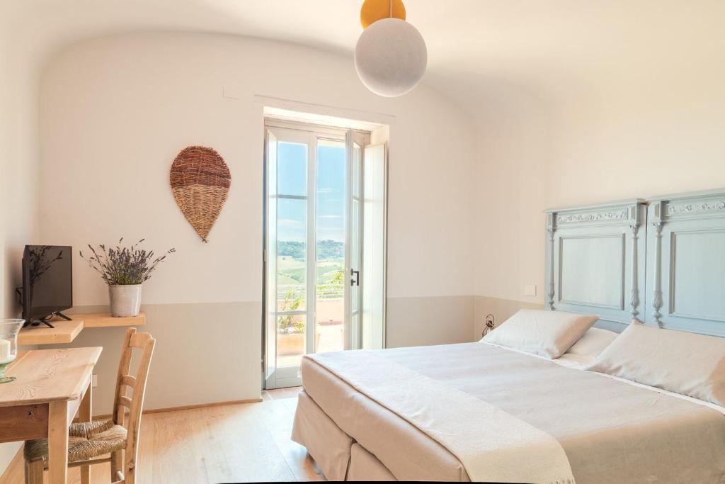 Postel nebo postele na pokoji v ubytování CUGUSI BnB