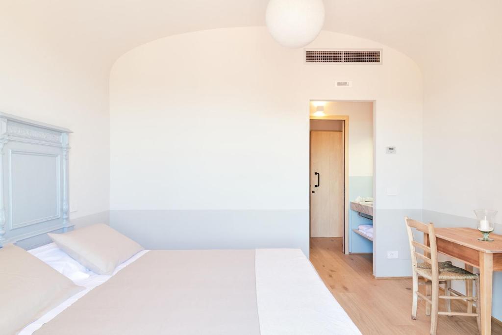 Postel nebo postele na pokoji v ubytování CUGUSI BnB