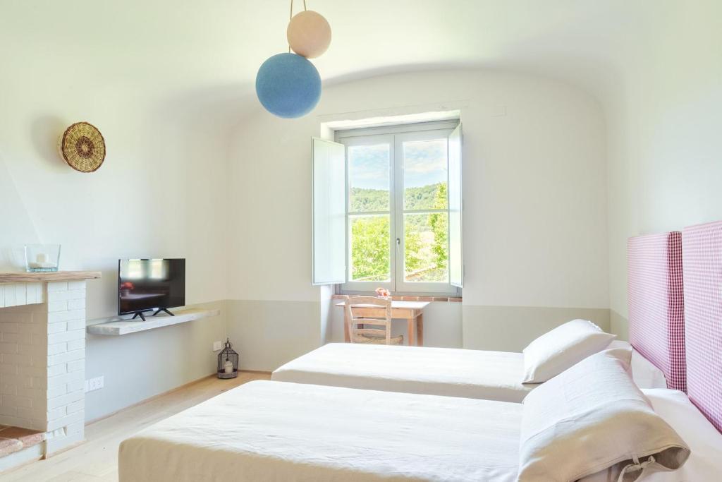 Postel nebo postele na pokoji v ubytování CUGUSI BnB