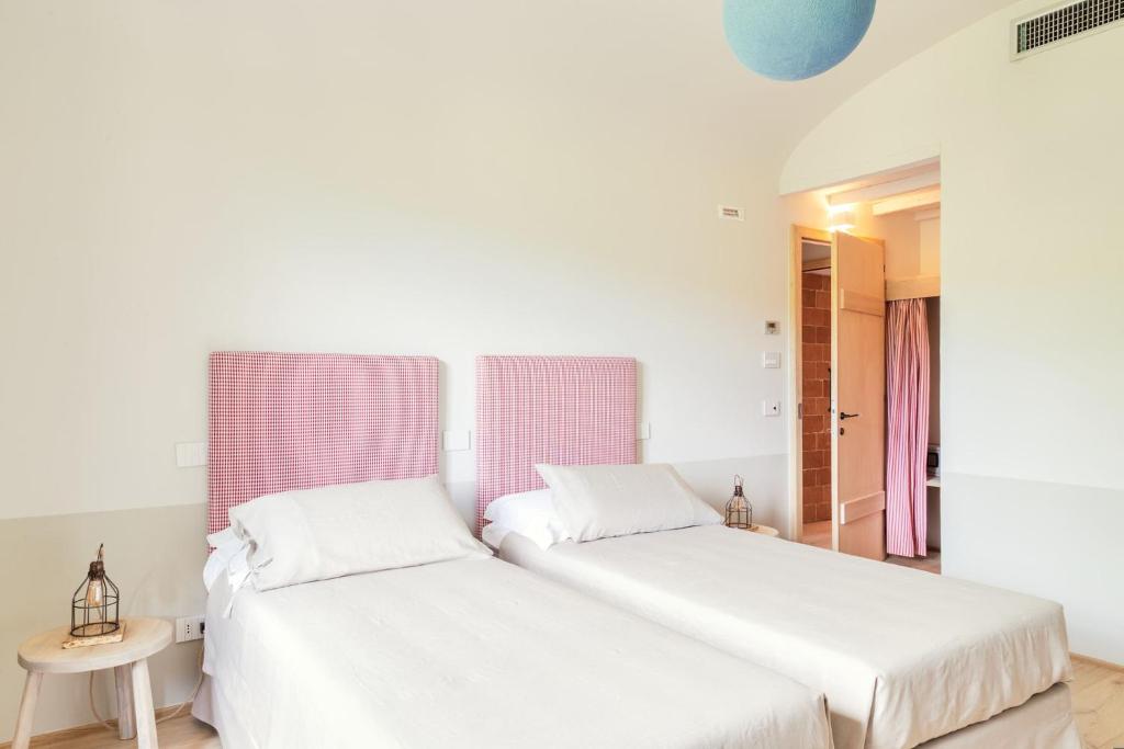 Postel nebo postele na pokoji v ubytování CUGUSI BnB