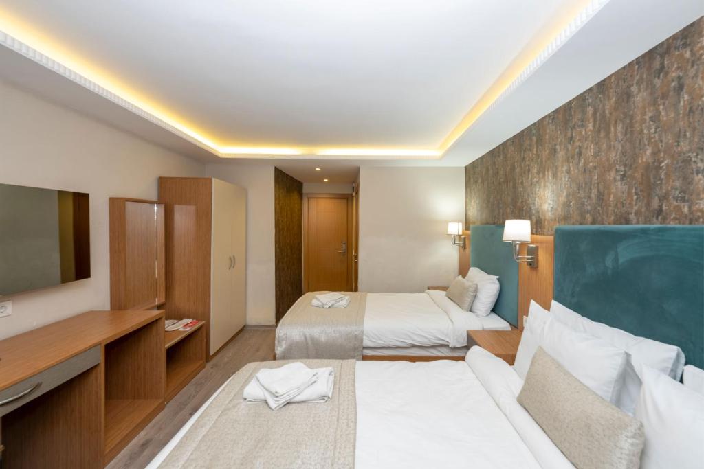 A bed or beds in a room at Hotel Devman