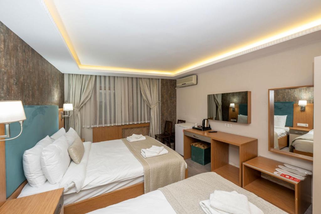 A bed or beds in a room at Hotel Devman