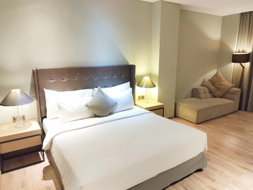 Postel nebo postele na pokoji v ubytování AONE Hotel