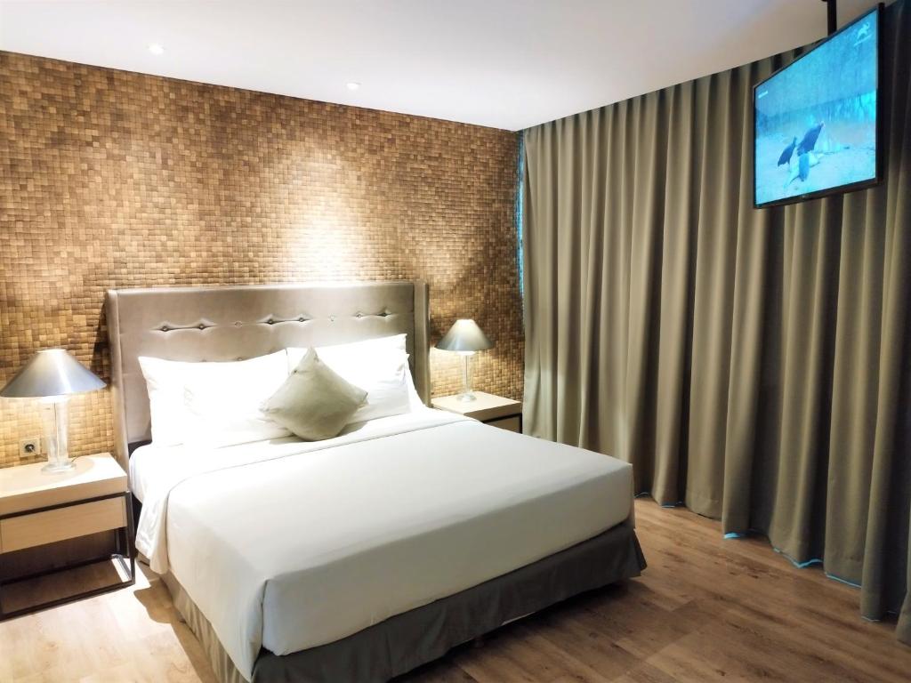 Postel nebo postele na pokoji v ubytování AONE Hotel
