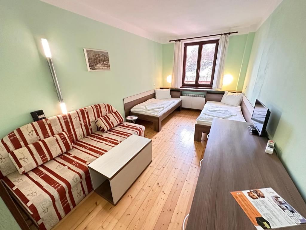 Postel nebo postele na pokoji v ubytování Hotel N