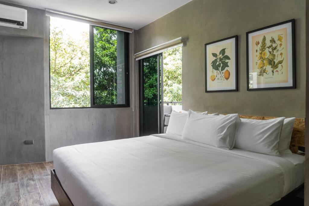 Postel nebo postele na pokoji v ubytování Hotel Dumaguete