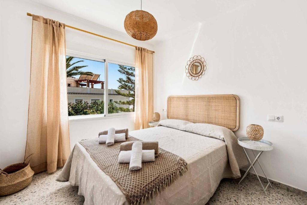 A bed or beds in a room at Villa El Algarrobo