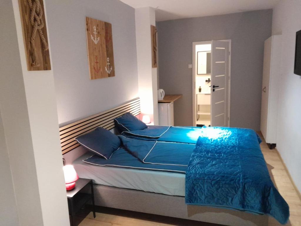 Postel nebo postele na pokoji v ubytování BIG BLUE Apartments - 2 osobowy