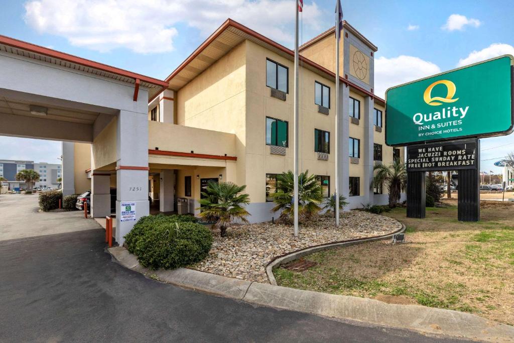 a hotel building with a sign in front of it at Quality Inn & Suites Ft Jackson Maingate in Columbia