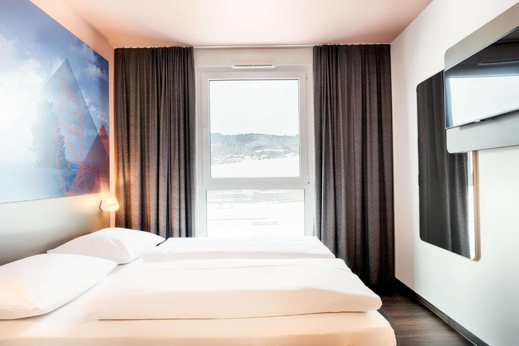 Postel nebo postele na pokoji v ubytování B&B Hotel Willingen