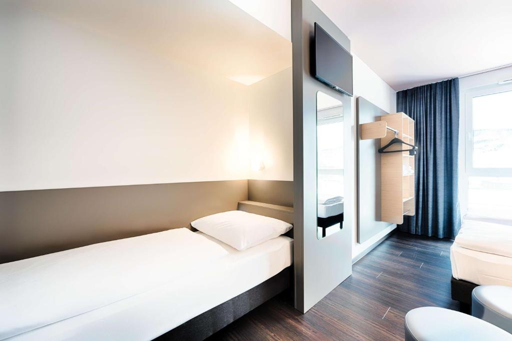 Postel nebo postele na pokoji v ubytování B&B Hotel Willingen