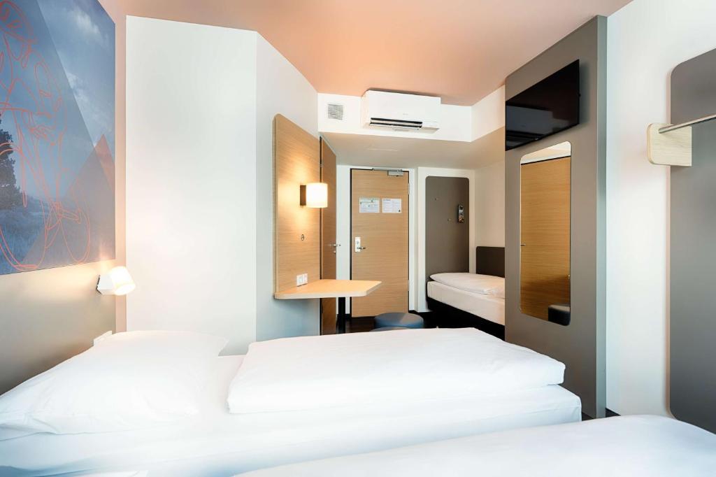 Postel nebo postele na pokoji v ubytování B&B Hotel Willingen