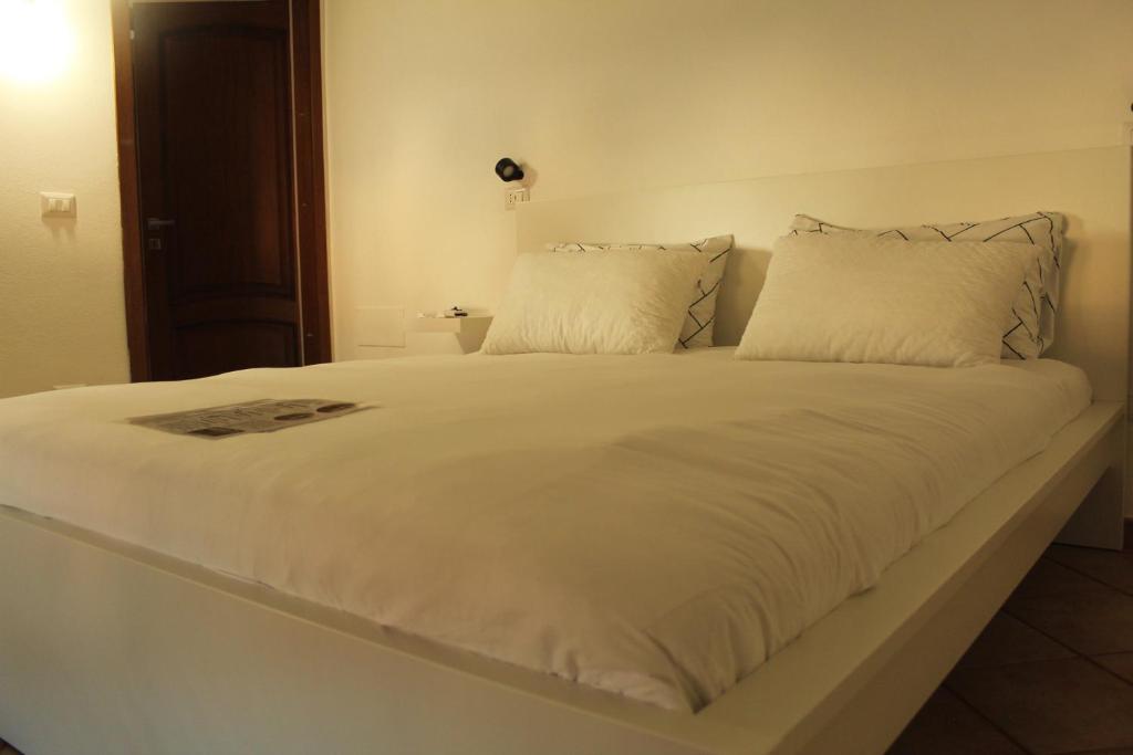 Postel nebo postele na pokoji v ubytování B-Guest House