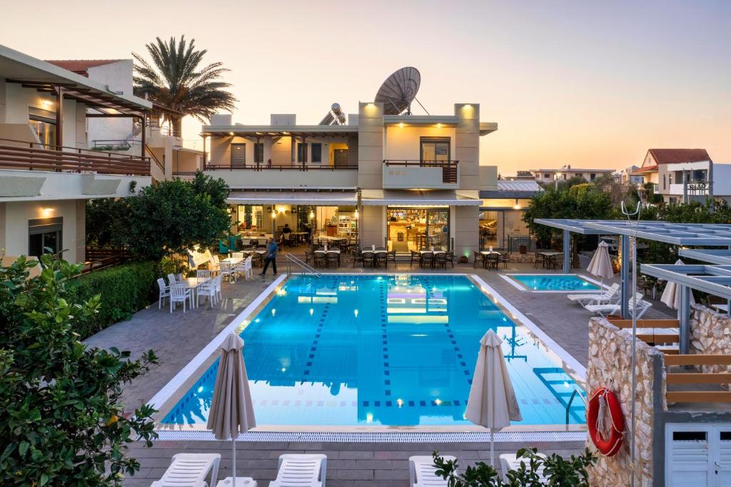 an image of a house with a swimming pool at Ilyssion Holidays Hotel in Ialysos