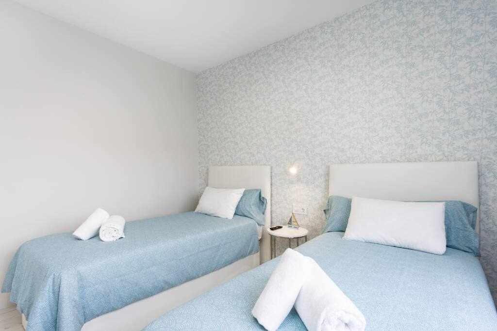 Postel nebo postele na pokoji v ubytování Sunnyland Villa Sueño Azul