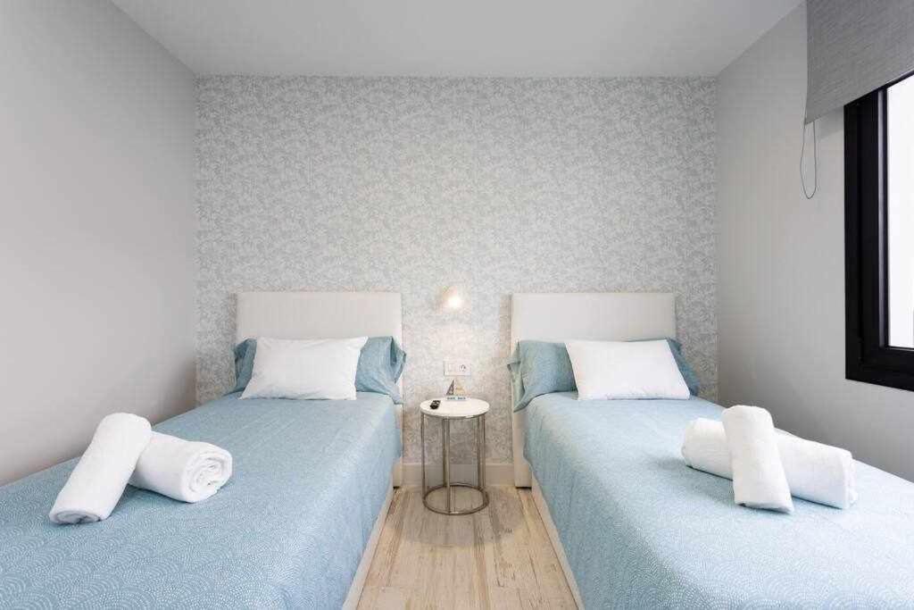 Postel nebo postele na pokoji v ubytování Sunnyland Villa Sueño Azul