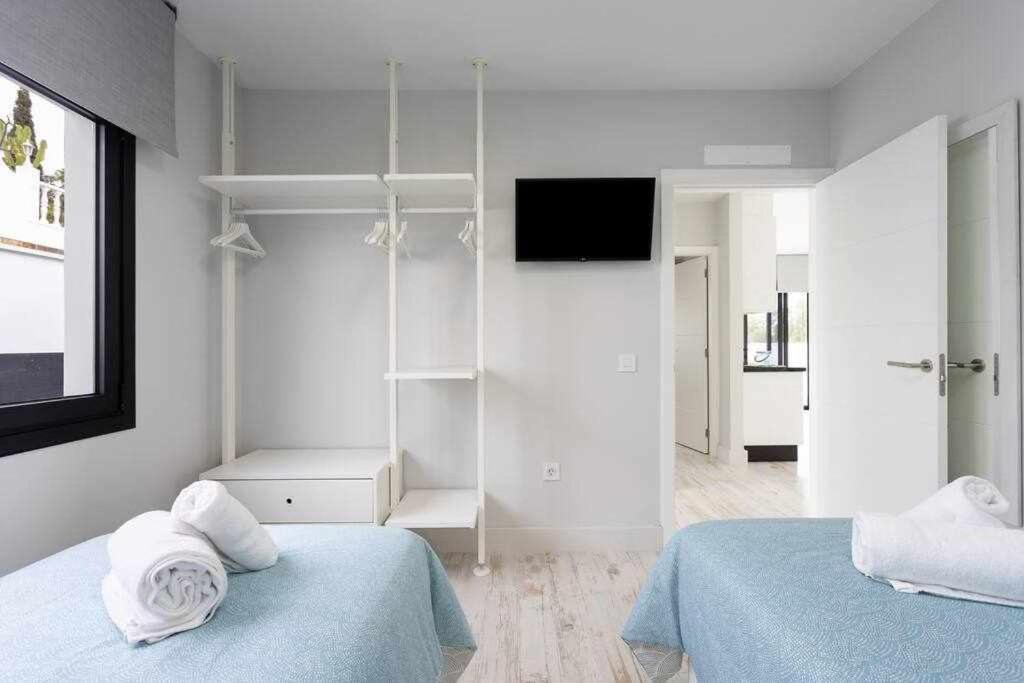 Postel nebo postele na pokoji v ubytování Sunnyland Villa Sueño Azul