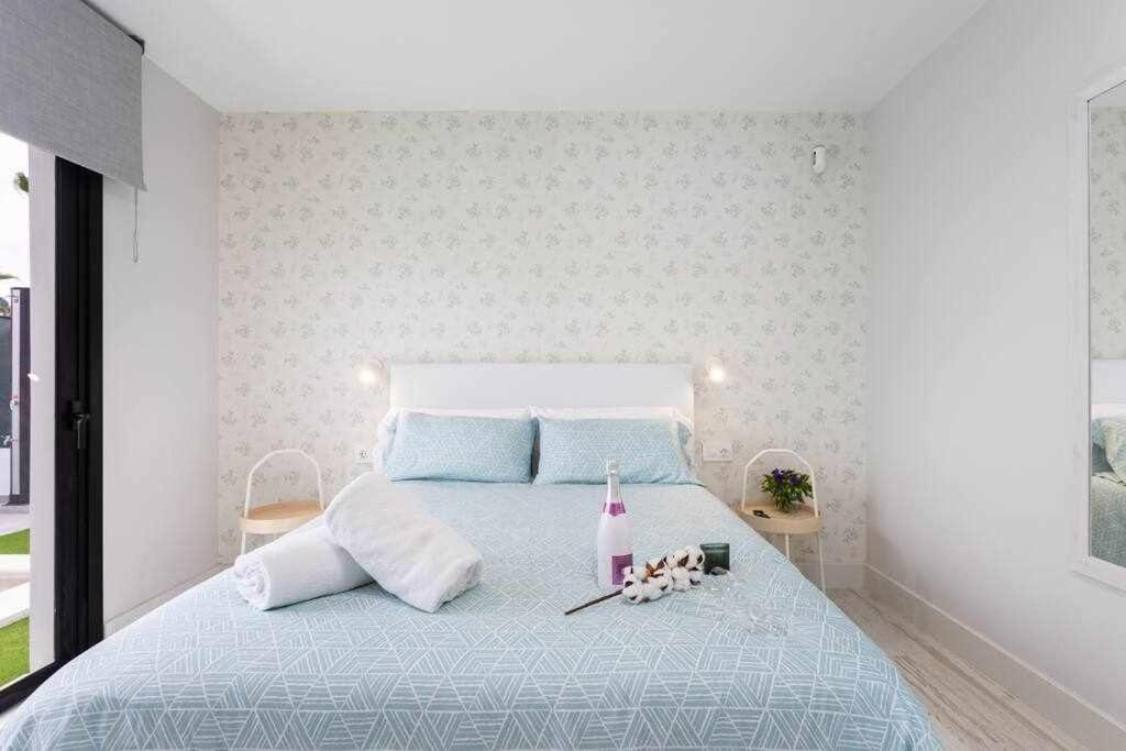 Postel nebo postele na pokoji v ubytování Sunnyland Villa Sueño Azul