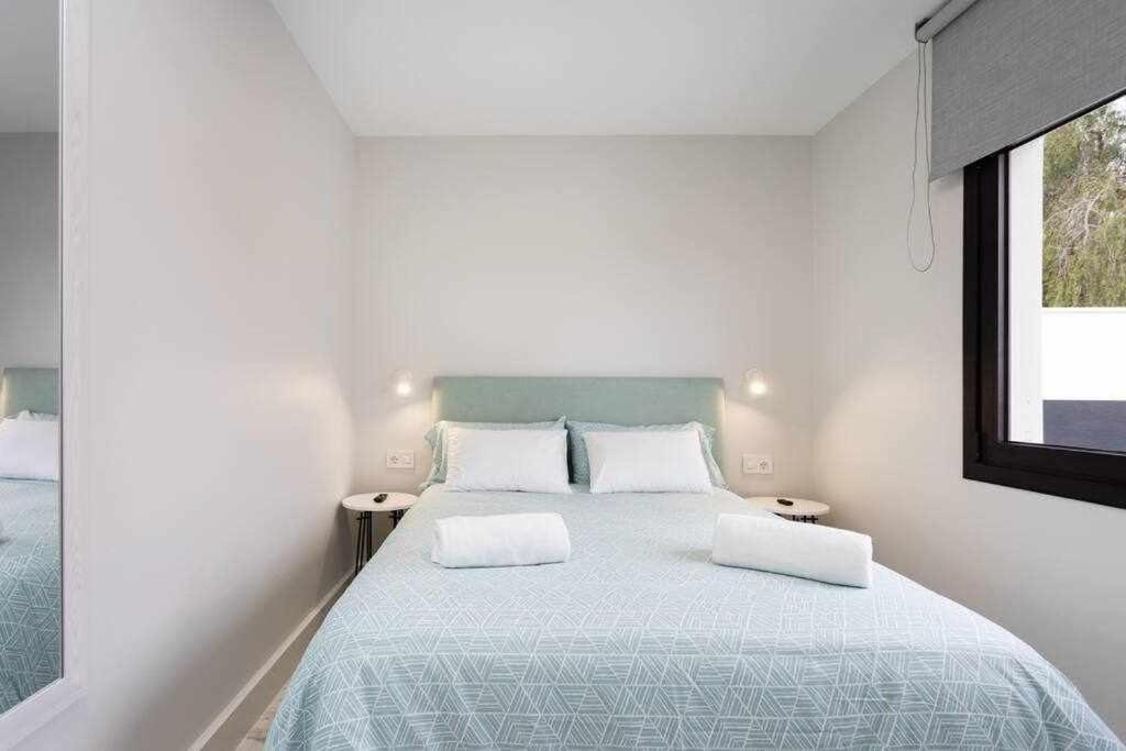 Postel nebo postele na pokoji v ubytování Sunnyland Villa Sueño Azul