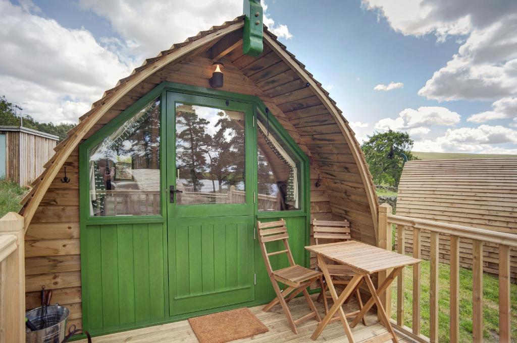 a gazebo with a table and chairs on a deck at Finest Retreats - Barebones Glamping in Hexham