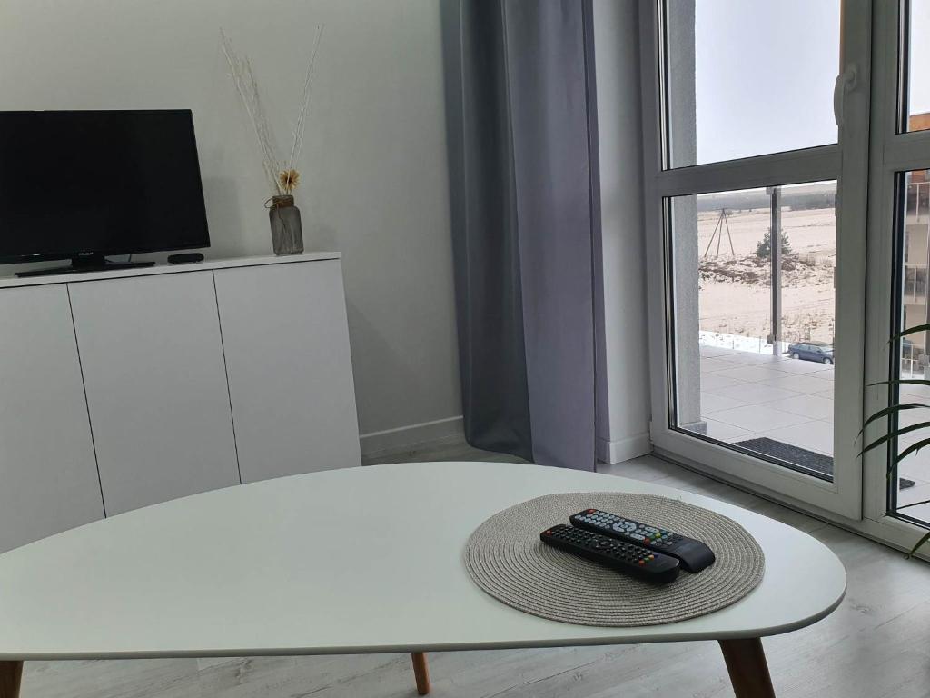 Televízia a/alebo spoločenská miestnosť v ubytovaní Welcome Apartment