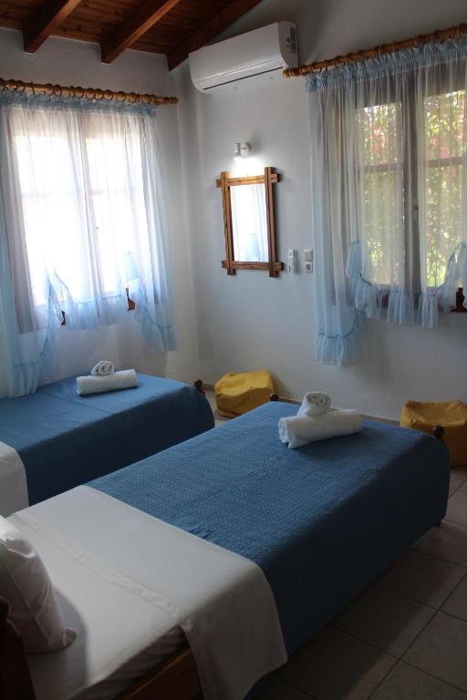 Postel nebo postele na pokoji v ubytování Anastazia Paradise