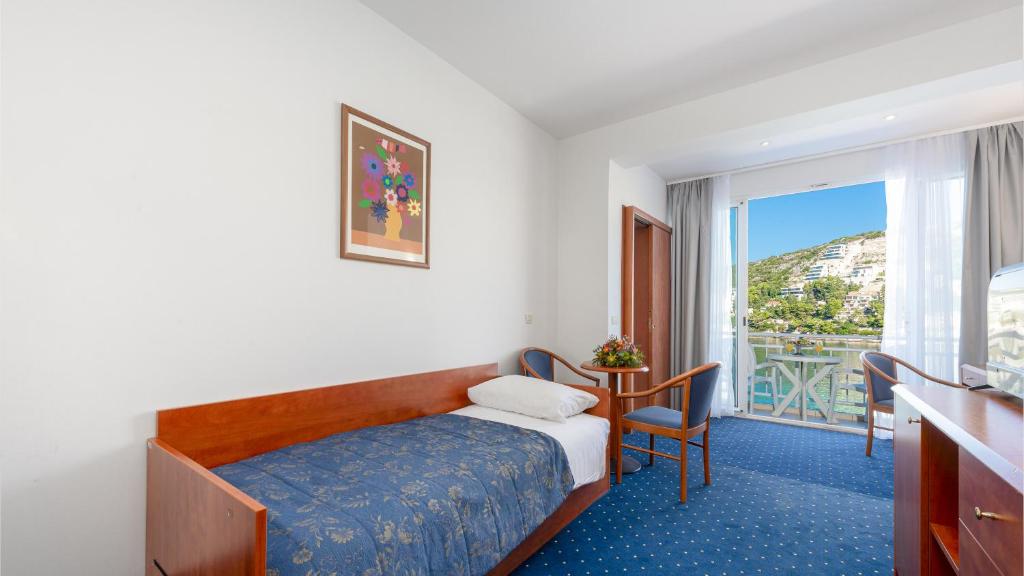 Postel nebo postele na pokoji v ubytování Hotel Vis