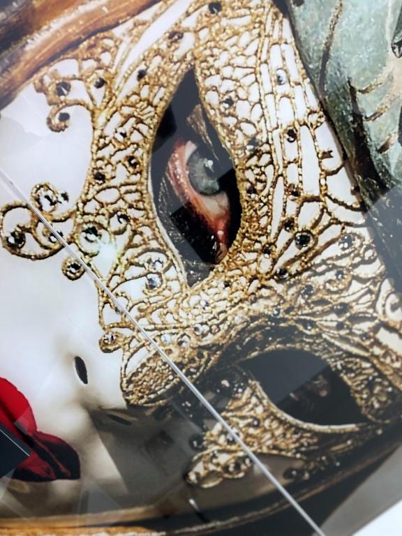 a close up of a mask with gold embellishment at Casa Del Sole in Alba Iulia