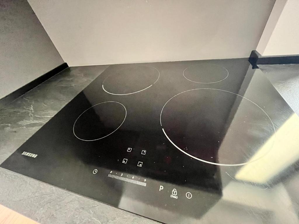 a black floor with a black and white object at Kibilù - Via Taormina - Ospedale Niguarda - Isola in Milan