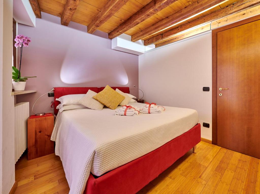 Postel nebo postele na pokoji v ubytování La Casetta a Santo Stefano