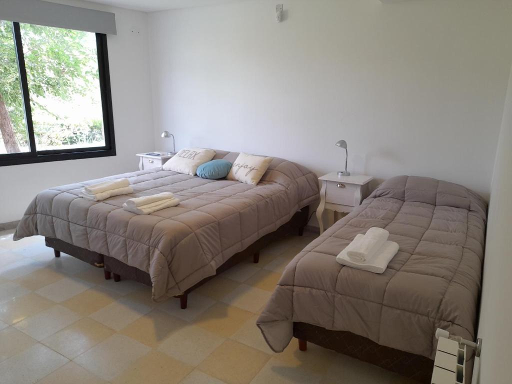Ліжко або ліжка в номері Aguamansa Apart