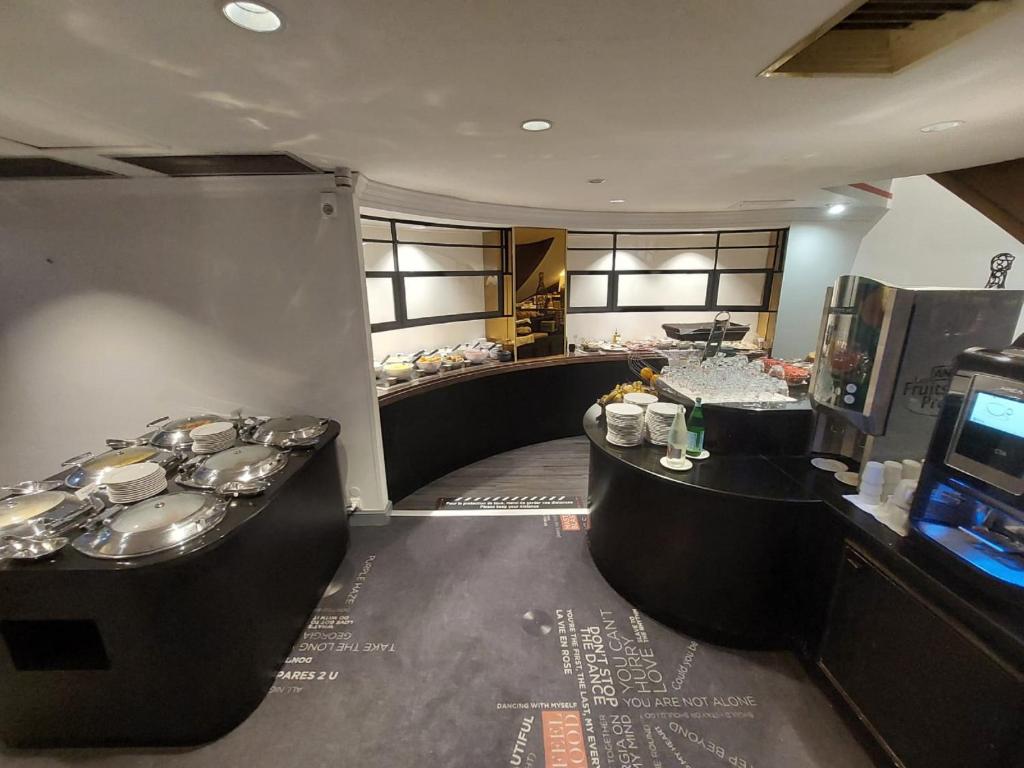 Kuchyň nebo kuchyňský kout v ubytování Plaza Hotel Capitole Toulouse