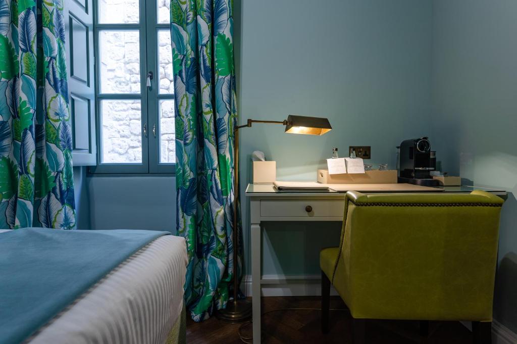 Postel nebo postele na pokoji v ubytování Palazzo Bifora