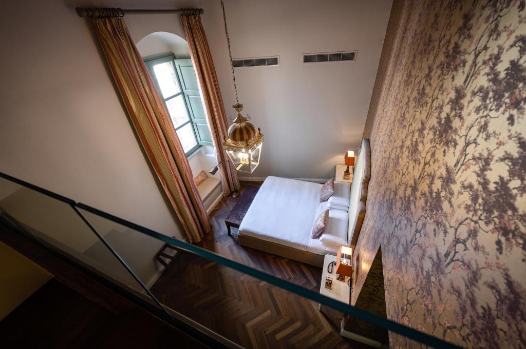 Postel nebo postele na pokoji v ubytování Palazzo Bifora