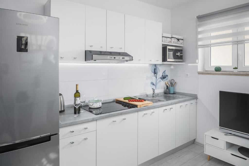 Kuchyň nebo kuchyňský kout v ubytování Apartment Sea Pearl