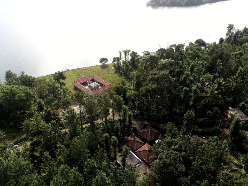 an overhead view of a house on a hill with trees at FoRest cottage coorg in Madikeri