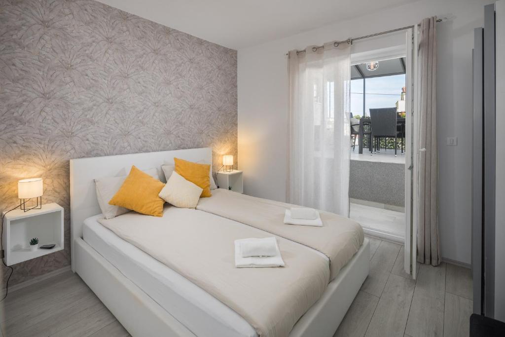 Postel nebo postele na pokoji v ubytování Apartment Sea Pearl