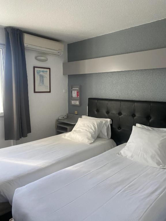 Letto o letti in una camera di Fasthotel Mont de Marsan