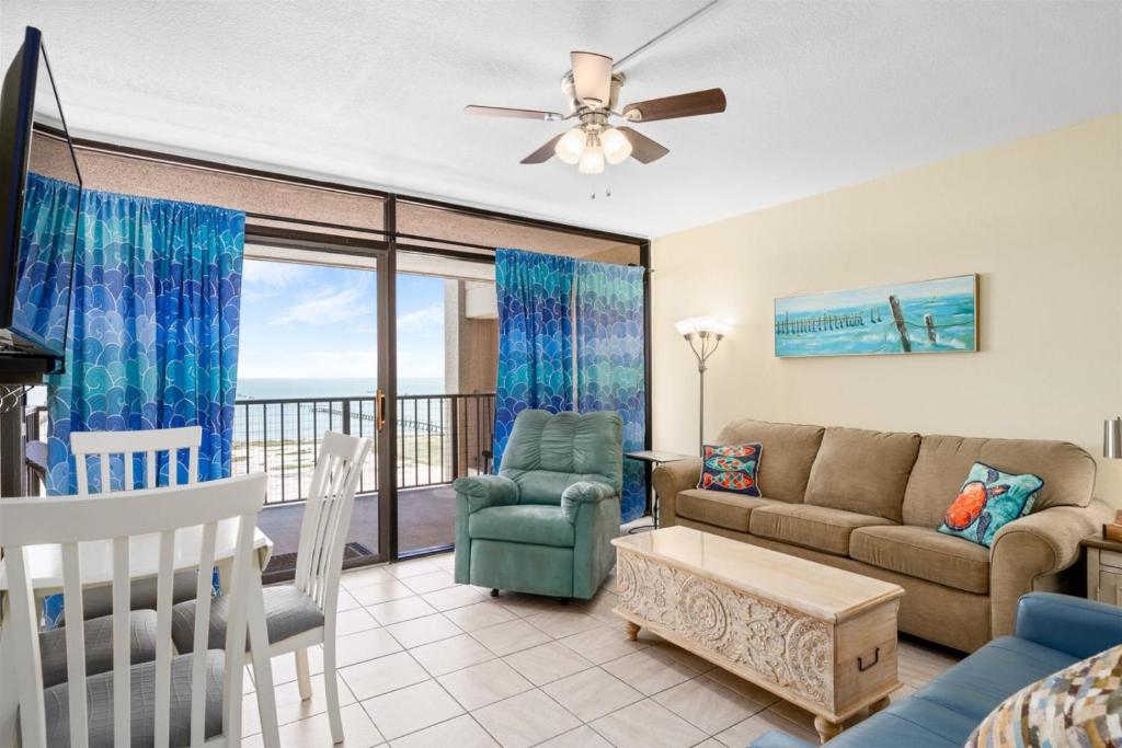 a living room with a couch and a table at Laguna Reef #410 - BraveWave in Rockport